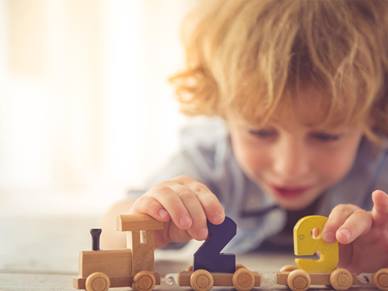 boy playing with train