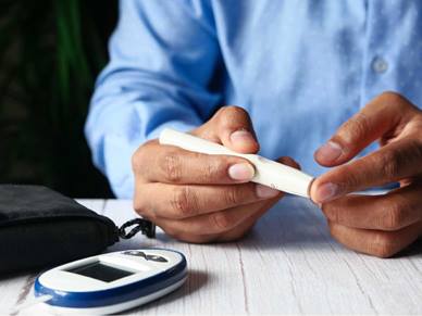 A man checking his insulin levels
