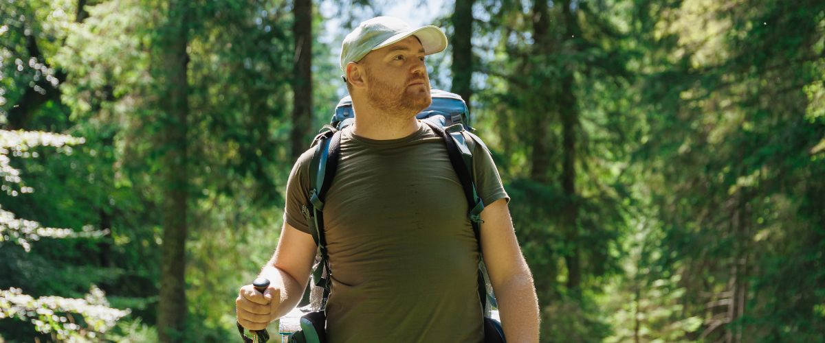 man-silent-walking-in-a-forest