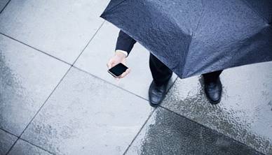 Office worker with umbrella