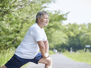 Man stretching in park