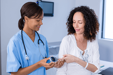 Female doctor with female patient