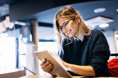 Smiling woman on tablet device