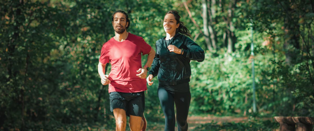 People running outdoors, sunshine woods happy